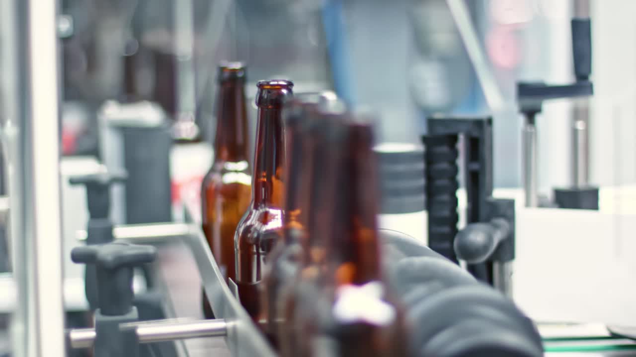 Bottles on conveyor belt in beer factory