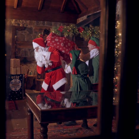 santa claus holding bag with presents