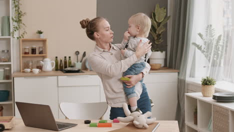 woman having business call and babysitting