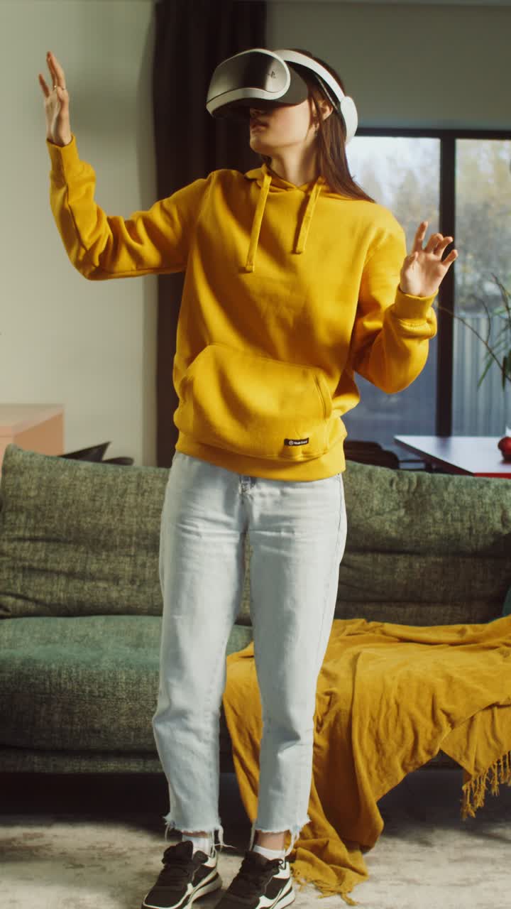 Woman experiencing virtual reality in her living room
