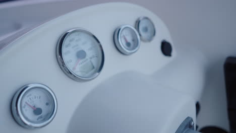 close-up of a boat's dashboard with gauges