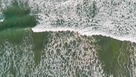 Overhead-Shot-Of-Beautiful-Soft-Waves-In-Peaceful-Blue-Ocean