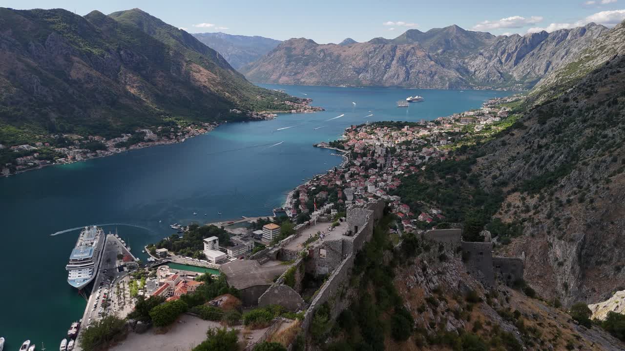 Coastal aerial approaches medieval fort high above Kotor, Montenegro