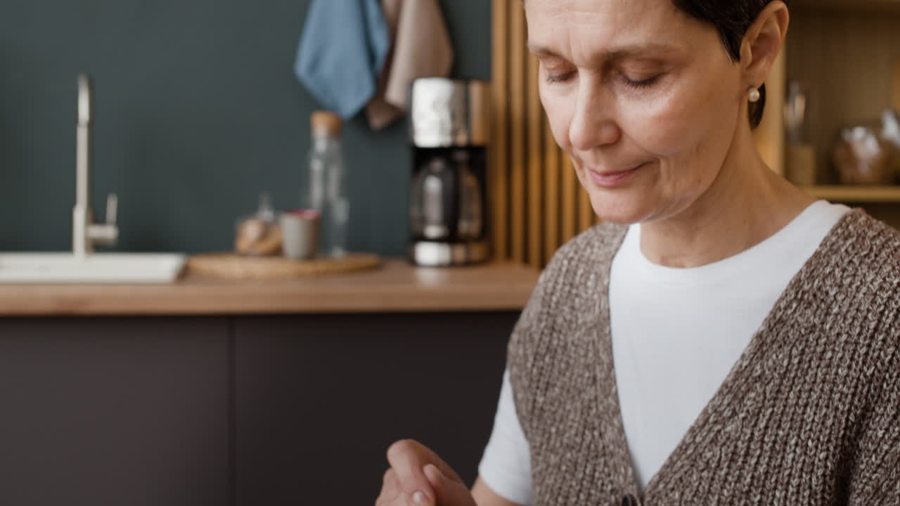 Person Spreading Jam on Toast for Breakfast