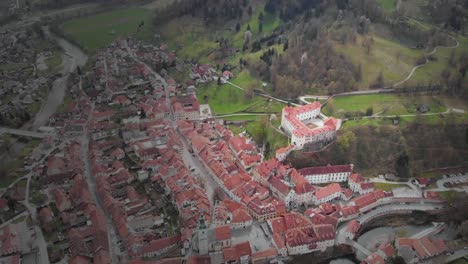 round drone shot of a castle and museum skofja loka, slovenia