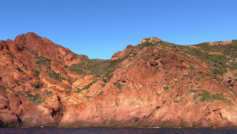 Red-rocks-at-Scandola-peninsula-nature-reserve-in-summer-season-with-blue-sky,-Corsica-island-in-France