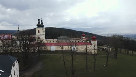 aerial perspective of the hedeč pilgrimage site, highlighting the magnificent mother of god monastery nestled on the mountaintop, providing a breathtaking view of the czech republic