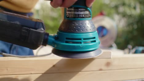 Close-up-of-sanding-the-wood