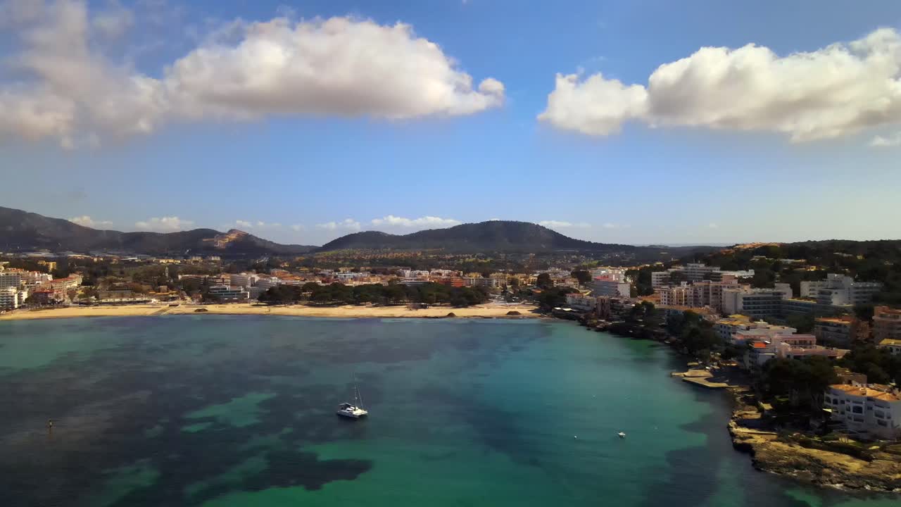 Experience breathtaking views of Santa Ponsa beach, glistening blue waters, and the scenic Mallorca coastline. Discover vibrant resorts, lush hills, and tranquil shores.