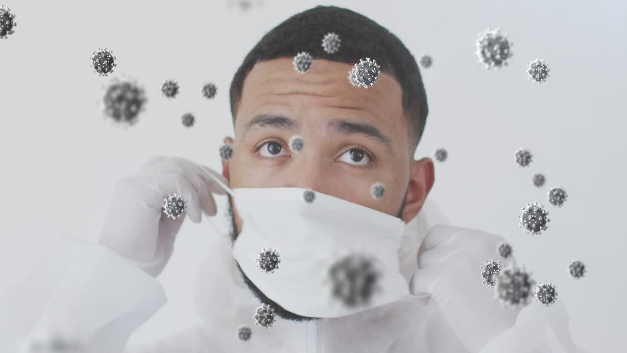 animación de células de virus sobre un hombre de dos razas que lleva una máscara facial