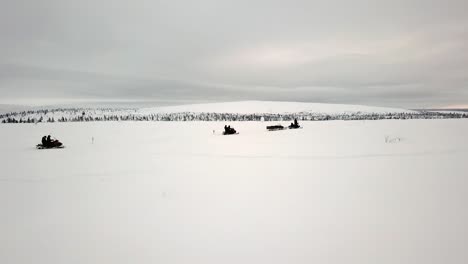 drone view of snowscootering in saariselka, lapland, finland