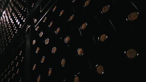 endless rows of aged wine bottles in atmospheric cellar