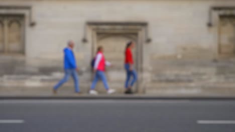 Defocused-Shot-of-People-and-Traffic-Travelling-Down-High-Street-In-Oxford-01