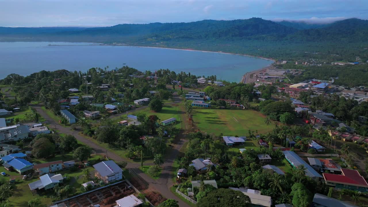 Wewak Hill Seawall shipwreck Meni Beach East aerial drone Wewak Sepik Region Province Papua New Guinea PNG summer morning sunrise dry season Dogreto Bay Boram road clear skies forward pan up motion