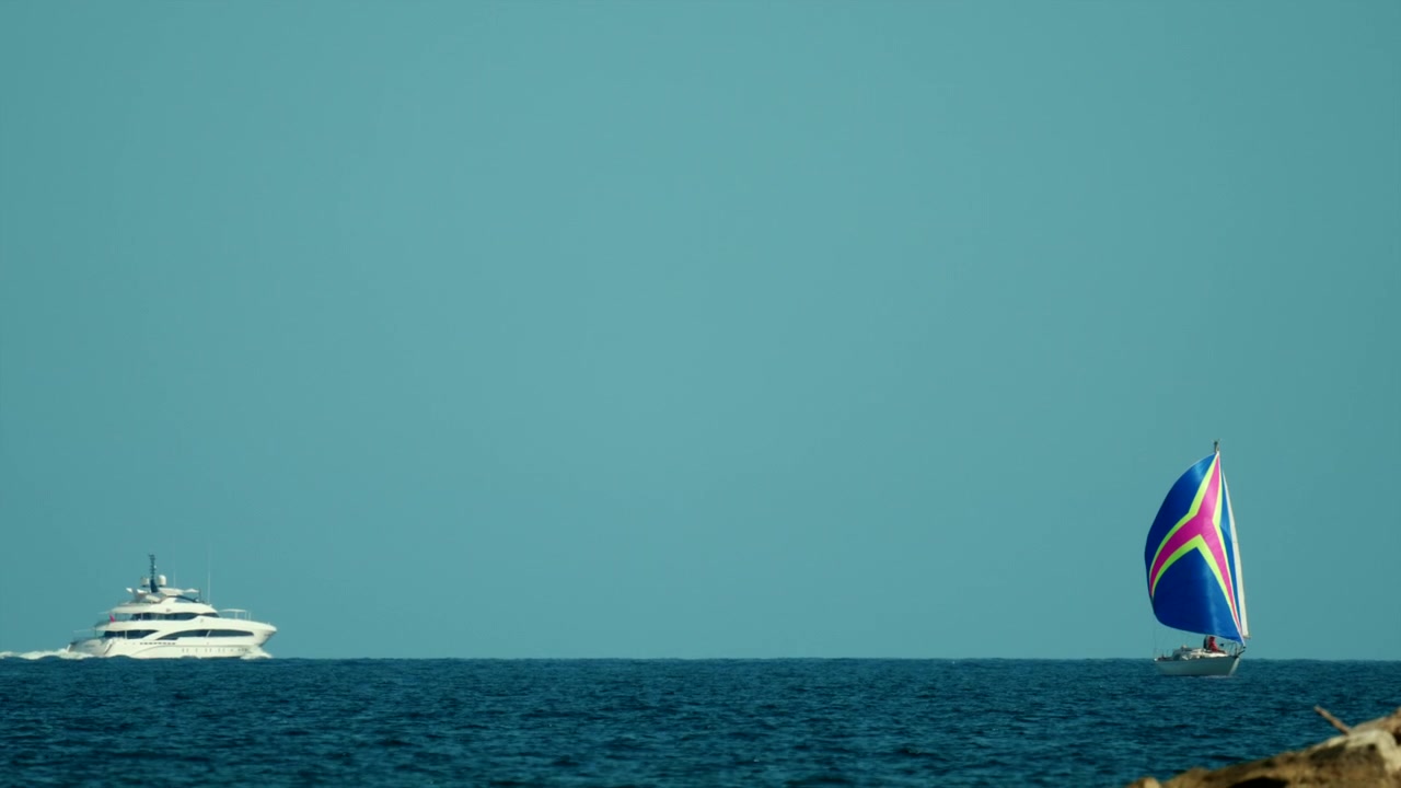 Yacht and sailboat sailing on open water, symbolizing luxury travel, freedom, and an active nautical lifestyle