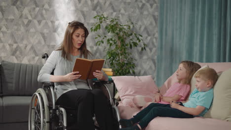 Mother reads interesting story to little daughter and son