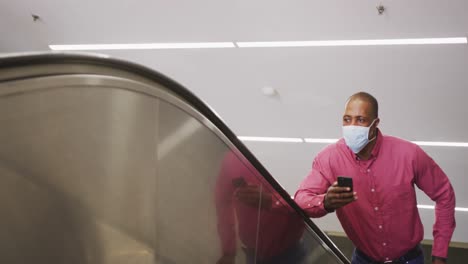 african american man on the go wearing coronavirus covid19 mask