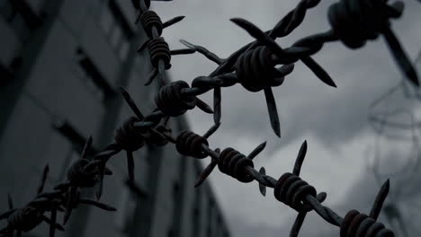 rusty barbed wire fence in a desolate area