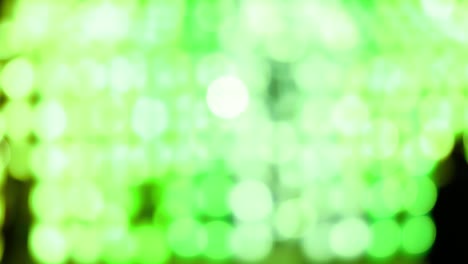 green abstract bokeh background of light from thai lanna lantern at night.  concepts of celebration in yi peng festival.