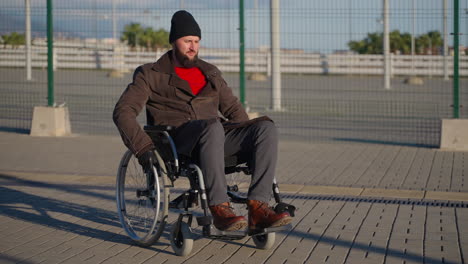 man in wheelchair outdoors