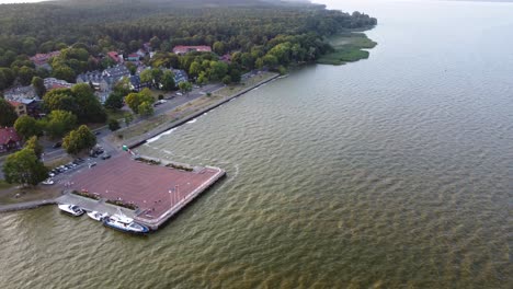 aerial orbiting shot of the resort town juodkrante coastline in lithuania