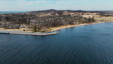 panning to the shore of north muskegon on the channel