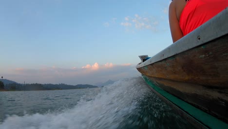 water splash from a drifting boat on the deep sea in thailand - closeup shot