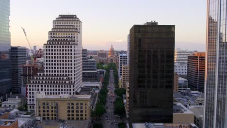 aerial view towards the texas state capitol, sunset in austin, usa - zoom in, drone shot