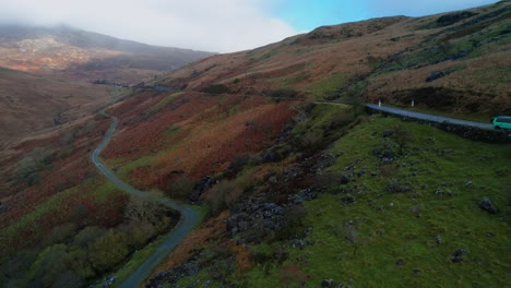 Car-driving-along-road-on-Pen-y-Pass-mountain-in-Snowdonia,-Gwynedd-in-north-west-Wales,-Uk