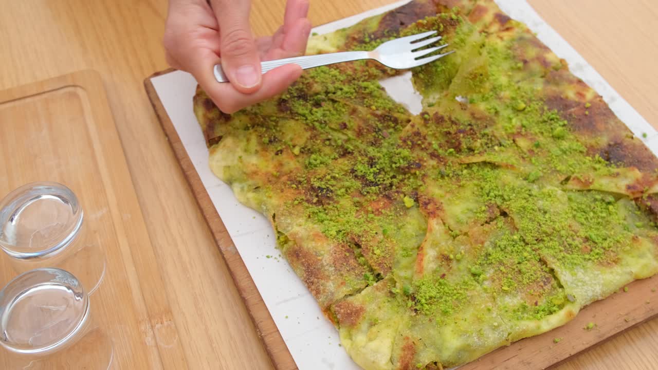 Traditional Gaziantep dessert Katmer with pistachio powder, Turkey