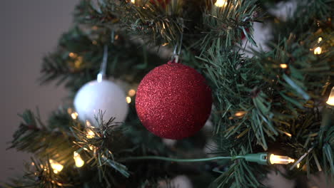 miscellaneous christmas ornaments on a christmas tree