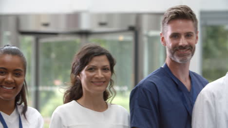portrait of medical staff standing in lobby of hospital