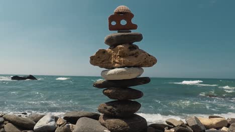 Stone-structure-on-the-beach-with-shell-on-the-top