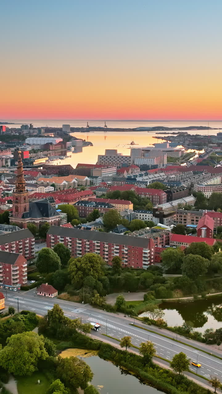 Aerial drone view of the Church of Our Saviour in the city centre of Copenhagen, Denmark at sunset. Vertical