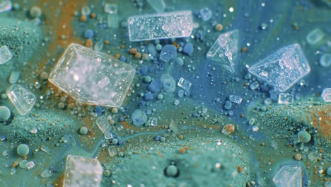 exploring the intricate patterns and textures of colorful fluid dynamics and crystal formations in a vivid abstract visual representation