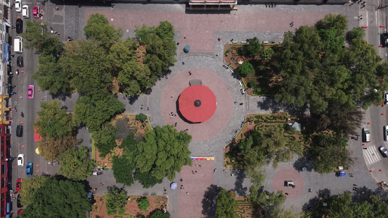 Aerial drone view of Coyoacán's central plaza, CDMX, captured while descending