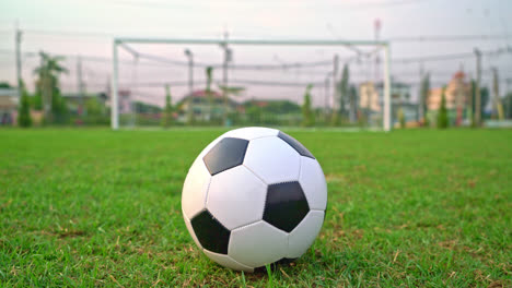 Soccer-ball-on-the-football-field--background