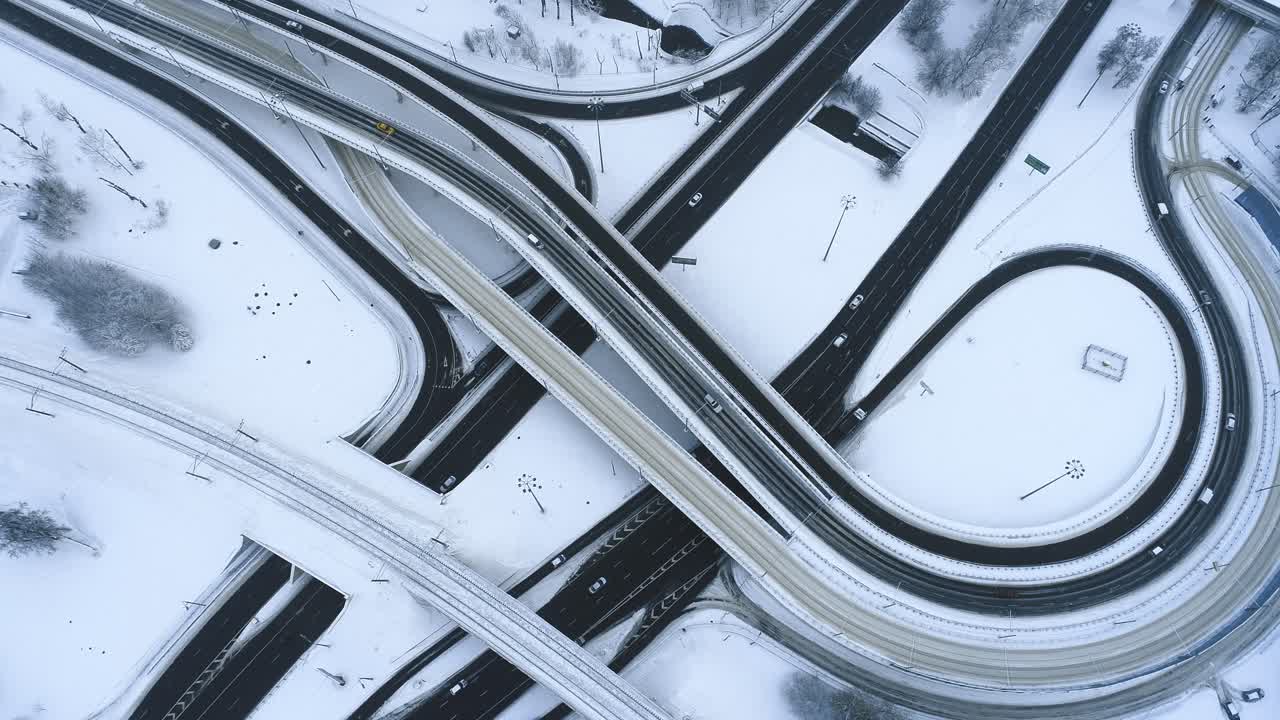 Aerial view of a freeway intersection Snow-covered in winter.