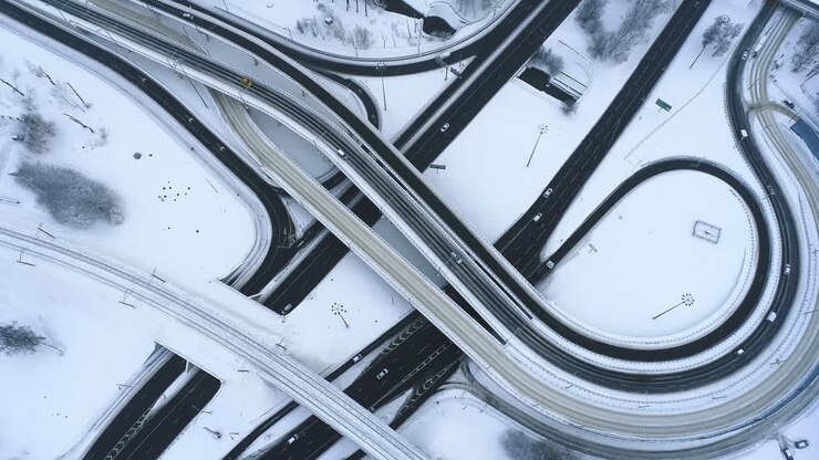 Aerial view of a freeway intersection Snow-covered in winter.