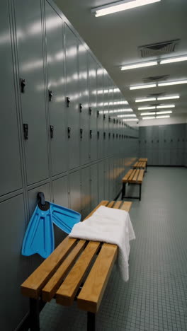 empty gym locker room with swimming equipment