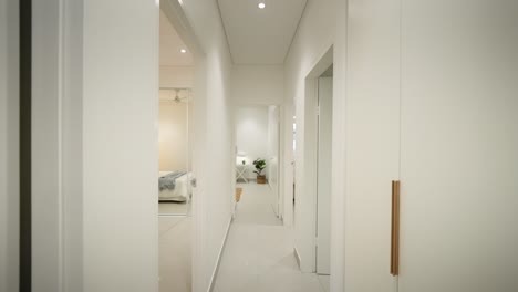 sleek modern hallway leading to a bedroom in a luxury small home, featuring minimalist design elements. interior of house home staged for real estate.