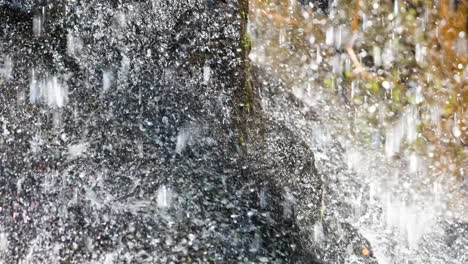 cascading water over rocks in chonburi, thailand