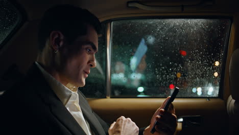happy entrepreneur rejoicing smartphone in vehicle closeup. manager celebrating