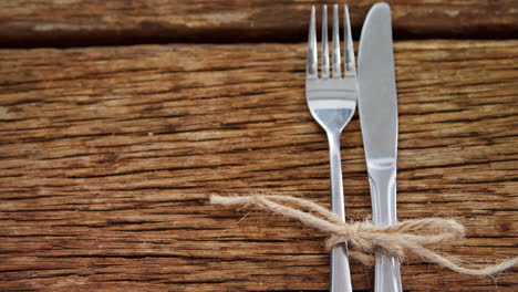 various cutlery on wooden table 4k