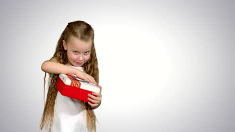 happy smiling girl holding gift box on white background