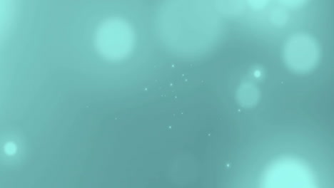 animation of light spots floating on green background