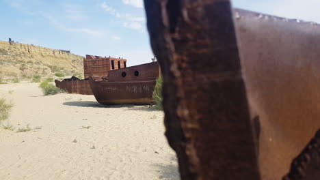 rusty corroded ships in sand, apocalyptic scenery from former aral sea, central asia