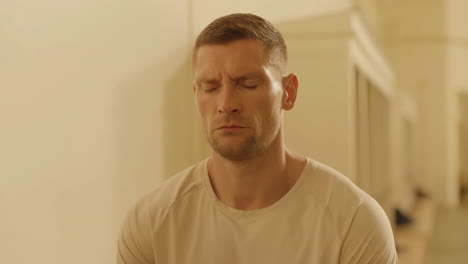 man meditating with eyes closed