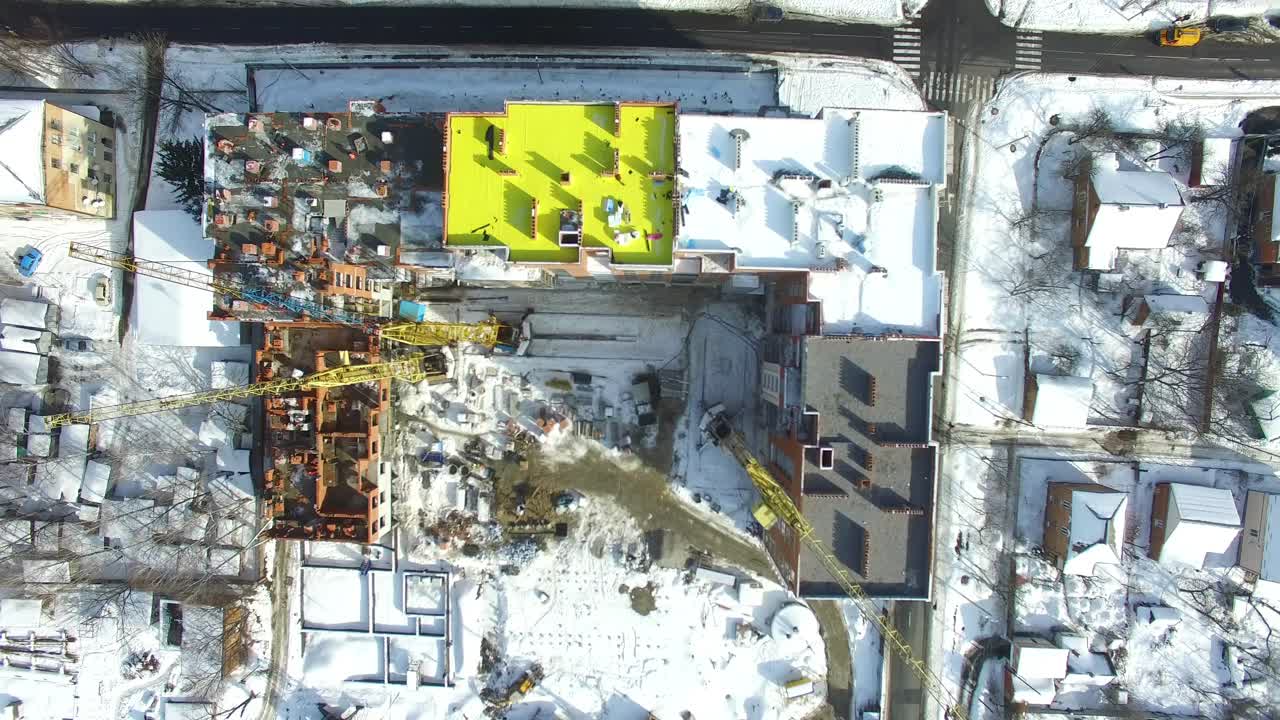 Construction crane and skyscraper. Building under construction in a new residential area