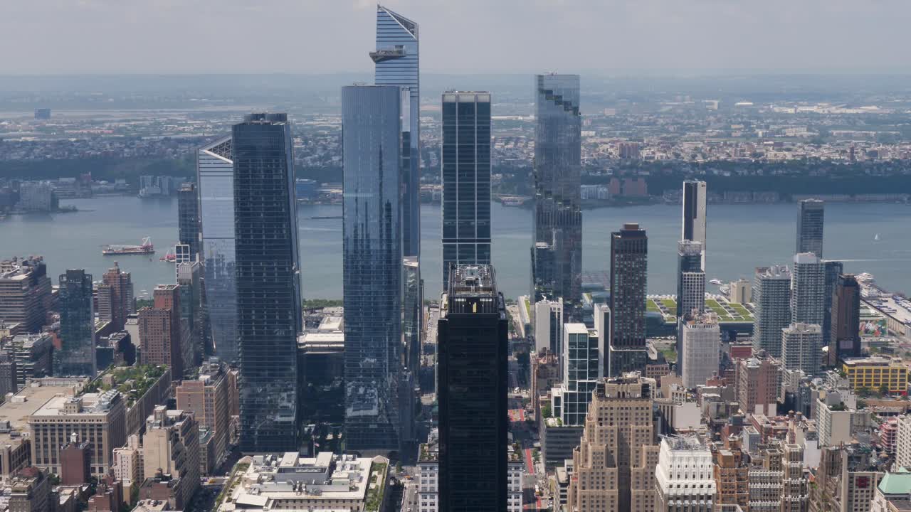 Slow motion landscape of commercial towers buildings infrastructure skyscrapers high rise New York city downtown district Manhattan USA America urban tourism Empire State